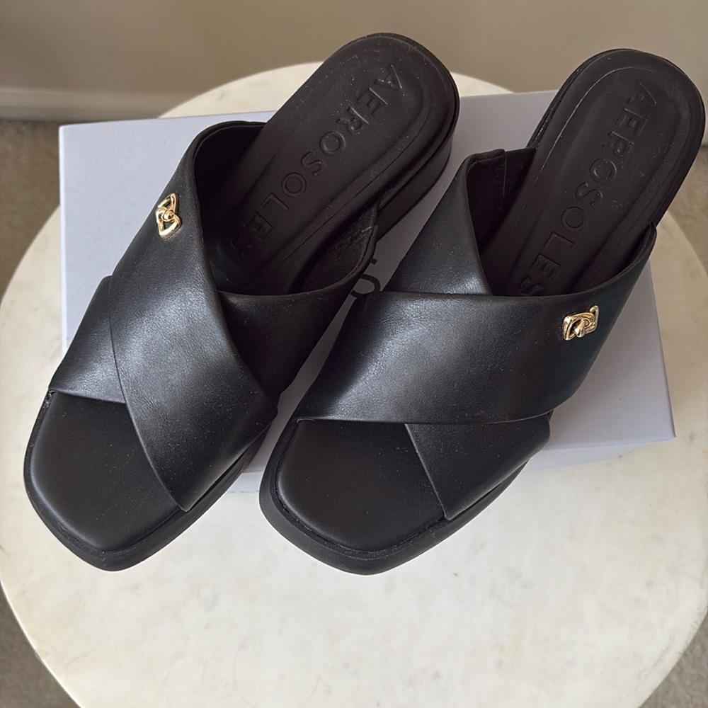 Aerosloles Duane sandals in black with small gold detailing